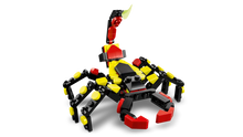 Load image into Gallery viewer, LEGO Creator 3-in-1 Surprising Spider build with red yellow and black pieces from Brick Shack boxed set