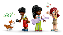 Load image into Gallery viewer, LEGO Friends Music Shop set 42653 featuring mini figures with musical instruments and a cute dog