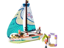 Load image into Gallery viewer, LEGO Friends Stephanie's Sailing Adventure set 41716 featuring a colourful sailboat and mini dolls at a dock