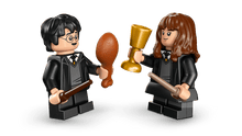 Load image into Gallery viewer, LEGO Harry Potter Sorting Hat Ceremony set 76460 featuring Harry and Hermione with wands and golden goblet