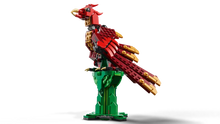Load image into Gallery viewer, LEGO medieval dragon set with red and gold dragon perched on green tower base