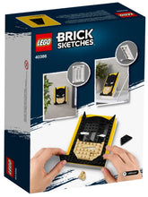 Load image into Gallery viewer, LEGO Batman Brick Sketches boxed set with hands assembling Batman face model in black and yellow