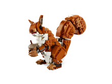 Load image into Gallery viewer, LEGO 31154 red fox for kids built from bricks showing detailed brown and white fox holding an acorn
