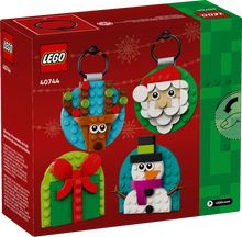 Load image into Gallery viewer, LEGO 40744 festive decorations boxed set featuring Santa, snowman, reindeer, and gift designs
