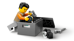 LEGO City Off-Road Mountain Truck minifigure examining treasure from Brick Shack boxed set