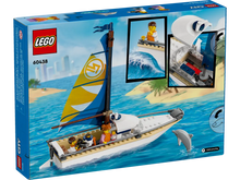 Load image into Gallery viewer, LEGO City sailboat set boxed with colourful sailboat and minifigures playing in ocean scene
