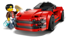 Load image into Gallery viewer, LEGO City sports car set featuring red LEGO car with a minifigure holding a bottle and sandwich
