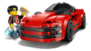 LEGO City sports car set featuring red LEGO car with a minifigure holding a bottle and sandwich