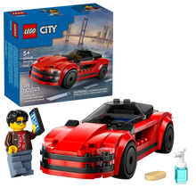 Load image into Gallery viewer, LEGO City sports car set with red convertible car and minifigure holding smartphone in boxed set
