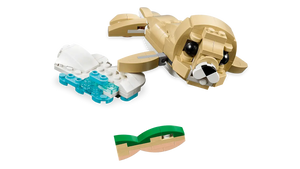 LEGO Creator 3 in 1 Cute Bunny build featuring a tan sea lion swimming with fish on black background