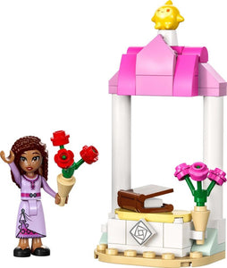 LEGO Disney Wish polybag featuring a girl minifigure with flowers and a pink and white wishing well build