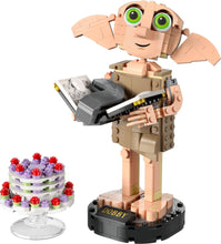 Load image into Gallery viewer, LEGO Dobby the House-Elf set by Brick Shack featuring Dobby figure holding a book and a detailed cake model
