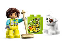 Load image into Gallery viewer, LEGO DUPLO Recycling Truck 10987 set with a character holding a broom and a dog figure
