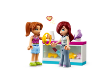 Load image into Gallery viewer, LEGO Friends Tiny Accessories Store set featuring two mini-dolls and a display counter with accessories
