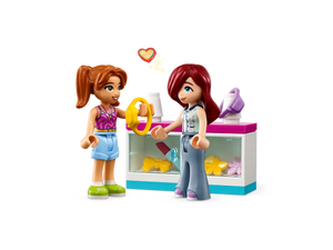 LEGO Friends Tiny Accessories Store set featuring two mini-dolls and a display counter with accessories