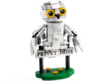 Load image into Gallery viewer, LEGO Harry Potter Hedwig set showing white owl perched on Privet Drive sign with flowers below
