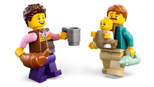 Load image into Gallery viewer, LEGO holiday camper van characters with a croissant, cup, baby, and bottle from Brick Shack boxed set
