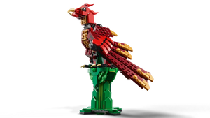 LEGO medieval dragon set with red and gold dragon perched on green tower base 