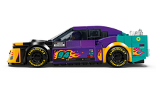 Load image into Gallery viewer, LEGO NASCAR Chevrolet Camaro ZL1 boxed set model showing purple race car with yellow Chevrolet branded wheels
