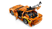 Load image into Gallery viewer, LEGO Technic Toyota Supra MK4 42204 boxed set featuring a detailed orange sports car with open engine and adjustable features

