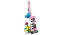 Load image into Gallery viewer, LEGO typewriter set with flowers in pink and blue by Brick Shack displayed on black background

