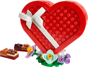LEGO Valentine's Day gift set featuring a red heart with a white bow and floral decorations