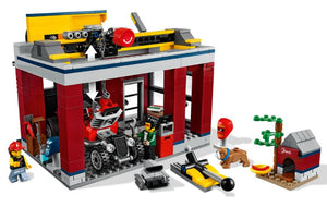 LEGO City Tuning Workshop set by Brick Shack featuring a detailed garage, tools, minifigures, and a doghouse