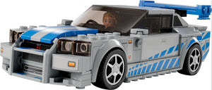 LEGO Speed Champions Nissan Skyline model car in grey with blue stripes and a driver minifigure